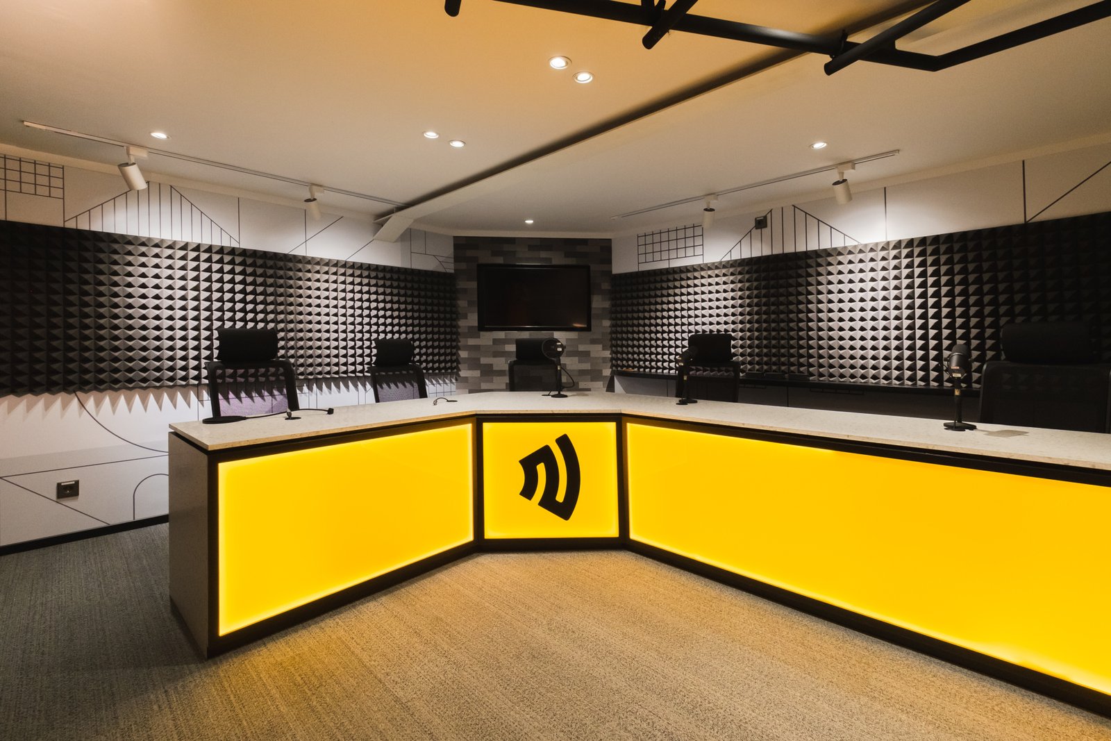 a podcast studio with black and yellow color tone