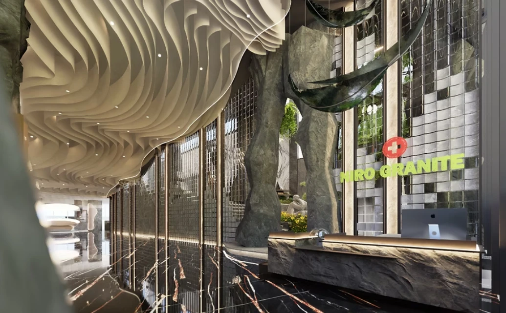 Area penerima tamu Showroom Niro yang menginterpretasikan bentang alam melalui bentuk arsitektural dan material bertekstur.